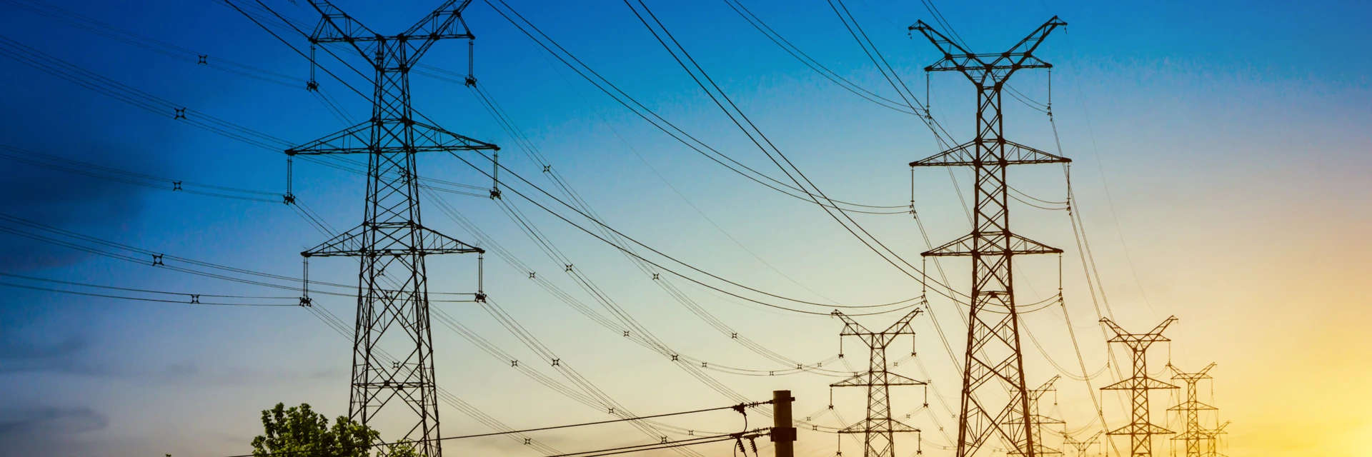 /uploads/media/hero_small_desktop_slide/05/415-sun-setting-silhouette-electricity-pylons.webp?v=1-0